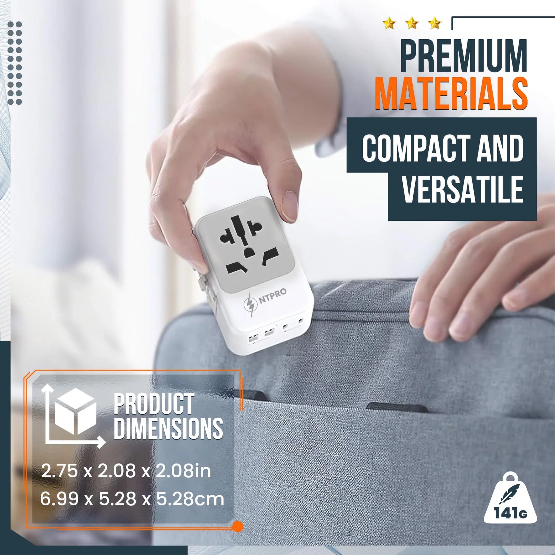Compact and lightweight travel adapter next to a hand and luggage for size reference