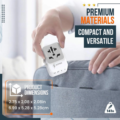 Compact and lightweight travel adapter next to a hand and luggage for size reference